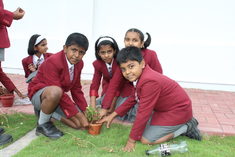 Students planting trees at RKL Galaxy International School